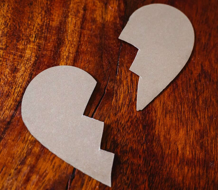 Broken Heart Cardboard on Brown Wooden Table Top